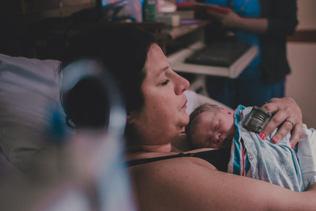 Mama and baby share skin to skin time, before baby goes to the NICU.